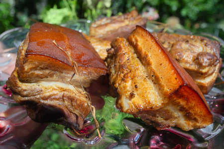 Homemade smoked pork cooked in the garden. Selective focusの写真素材