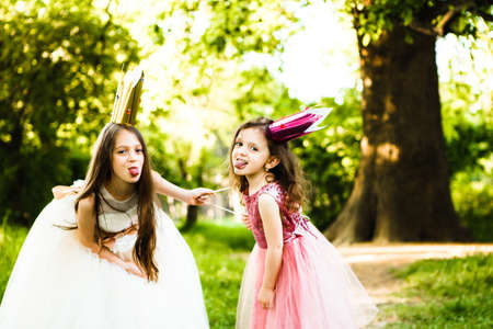 The sisters play princesses.
