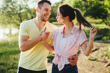 Shot of a young couple bonding trough walking in the nature.の写真素材