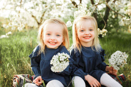 The twins are having fun in the park.の写真素材