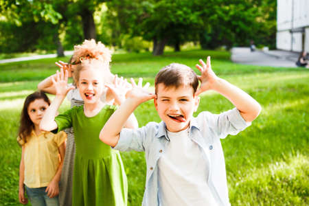 A group of children is having fun in the park.の写真素材