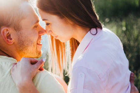 Young couple smiling looking at each other.の写真素材