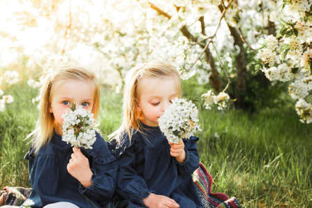 The twins are having fun in the park.の写真素材