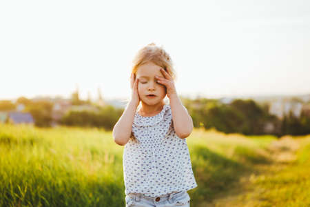 Little emotional girl. Emotion of sadness.の写真素材