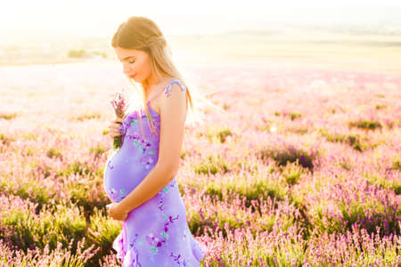 Beautiful girl on the lavender field.
