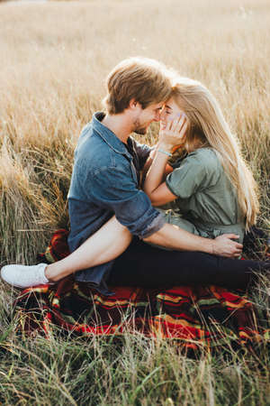 Young happy couple hugging and laughing. Space for text.の写真素材