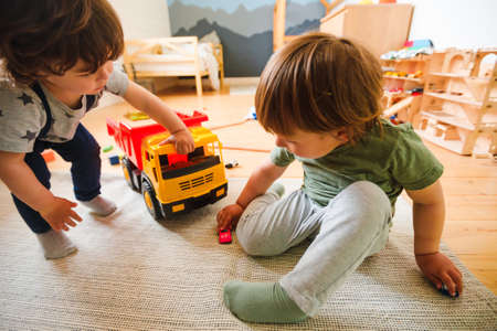 Children play in the nursery. Wooden interior. Home comfort.の写真素材