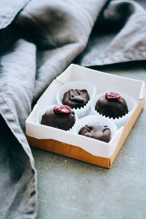 Useful raw chocolate sweets with cranberries and icingUseful raw chocolate sweets with cranberries...