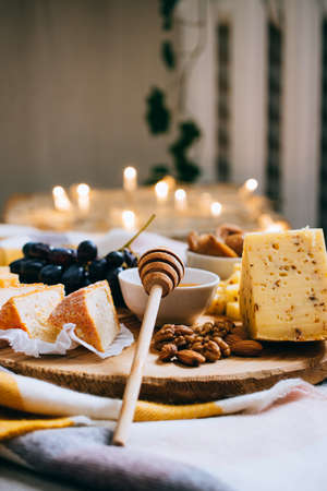 Cheese board, assorted cheese, comfort wine party dinnerの写真素材