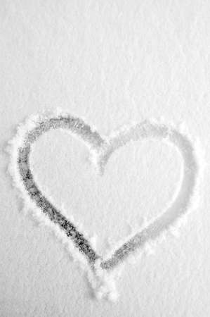 Heart on the fresh snowの写真素材