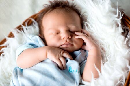 Pretty Newborn Baby Boy On Textile Background.の写真素材