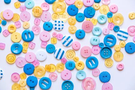 Flat lay with colorful sewing buttons, mock up, top view.の写真素材