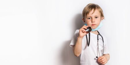 Cute Little Girl in medical mask with stethoscope isolated bannerの写真素材