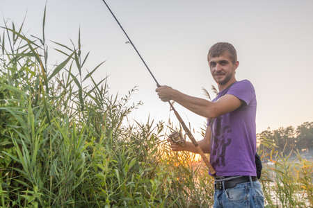 Stupino, Russia - 21 July 2014 - Fisherman with fishing rodのeditorial素材