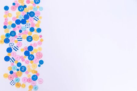 Flat lay with colorful sewing buttons, mock up, top view.の写真素材