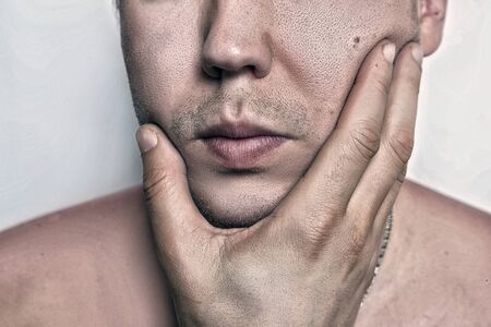 Shot of handsome attractive young caucasian male after shaving