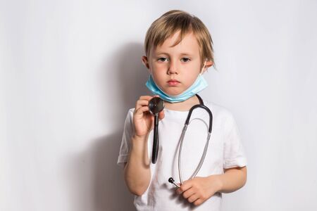 Cute Little Girl in medical mask with stethoscope isolated bannerの写真素材