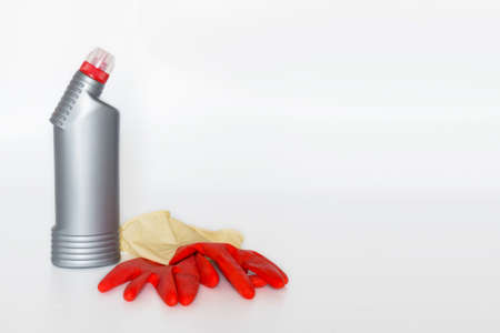 Plastic bottles with chemicals for home cleaning on a white background.