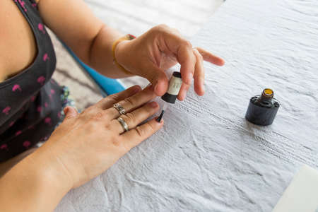 Staining nail gel polish. Self-manicure during self-isolation