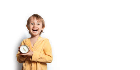 Cute girl in a yellow bathrobe with eye patchesの写真素材