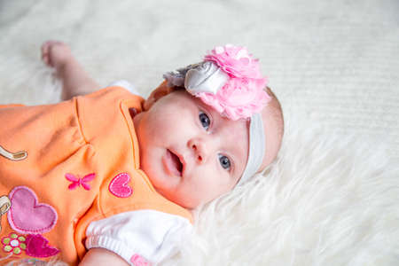 Portrait of cute adorable white Caucasian baby girl boy with one months old