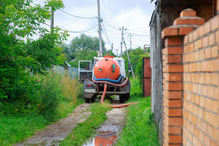 A Sewage truck working in village environmentの写真素材