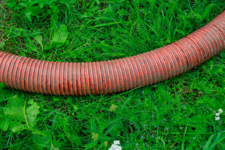 Pipe of a Sewage Pumping Machine. Providing Sewer Cleaning Service Outdoorの写真素材