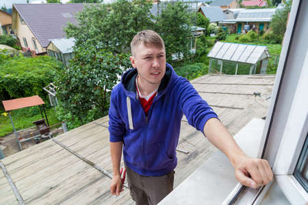 A man holding a garden pruner in his hands