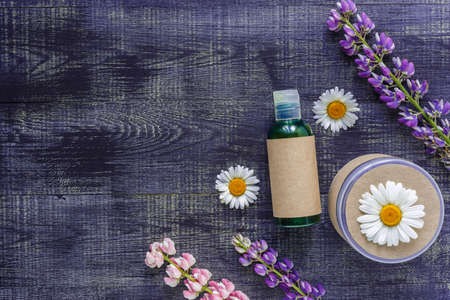 Cosmetic bottle containers with hermal camomile flowers Blank label for branding mock-up, Natural...