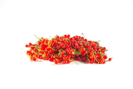 Ripe tasty red currants on the white background.