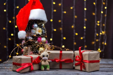 Christmas background with crocheted toy bull symbol of the yearの写真素材