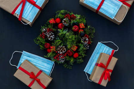 .New year in the context of coronavirus presents with medical masks on a chalk boardの写真素材