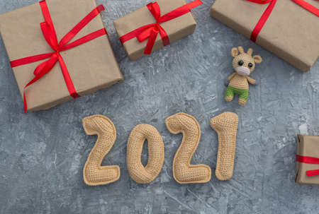 New year background with chroched toy bull symbol of chinese new year 2021 with craft paper gift...