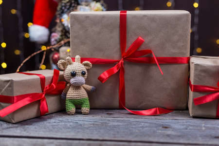 Christmas background with crocheted toy bull symbol of the year