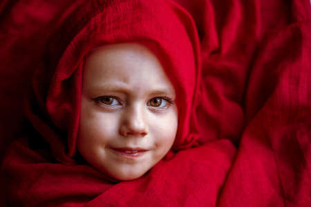 close-up portrait of a girl wrapped In Blanketの写真素材