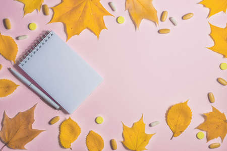 Autumn fallen leaves, office and medicines backgroundの写真素材