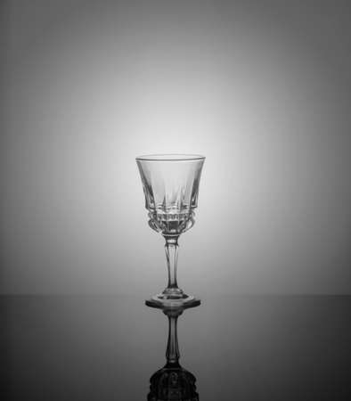 .empty drink glasses on dark background with back light.の写真素材
