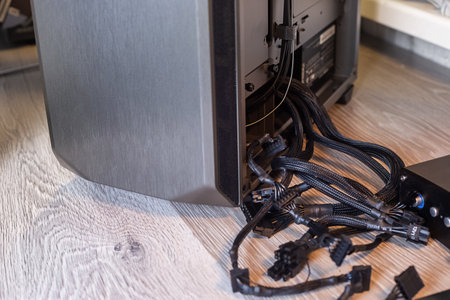 Cables and wires from the power supply for connection to computer components. Cable management and PC assembly.の写真素材