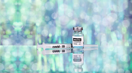 Coronavirus 2019-nCoV vaccine with syringe close up, medical concept, vaccination, injection,...