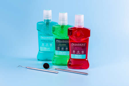Moscow, Russia - Matra 9 2021: Mouthwash on a blue background. The concept of proper oral care...