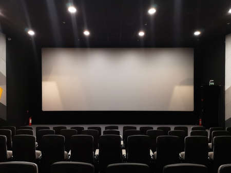 Cinema screen and empty chairs. Absence of visitors during the coronavirus pandemicの写真素材