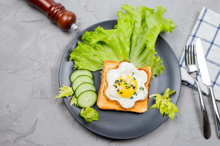 Healthy Restaurant breakfast with fry pan eggs with salad on white background top viewの写真素材