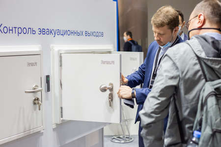 Moscow, Russia - 14 april 2021: A company representative presents products at a security exhibition