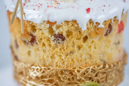 Close-up of an Easter cake. The porous surface of the cake made from yeast dough on a white...