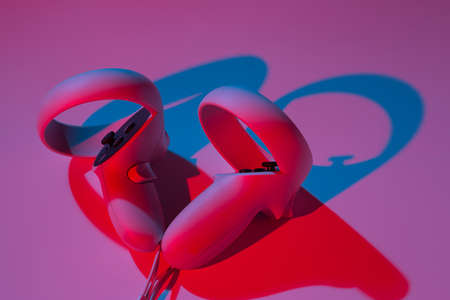 Virtual reality controllers for online and cloud gaming on white background in neon light. VR,...