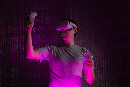 Young caucasian man 25-30 years using virtual reality headset. VR, future, gadgets, technology...