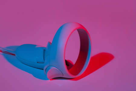 Virtual reality controllers for online and cloud gaming in neon light.の写真素材