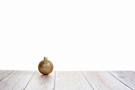 Christmas ball on white background on wooden table. Holiday decorationの写真素材