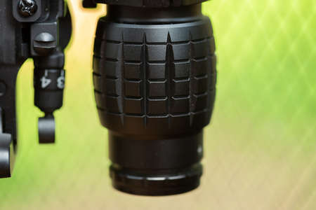 Close-up of parts of automatic weapon with selective focus and blurred backgroundの写真素材
