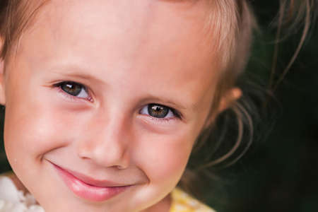 The caucasian child of 6 years is a beautiful girl with wide eyes, look at the camera. Expressive...